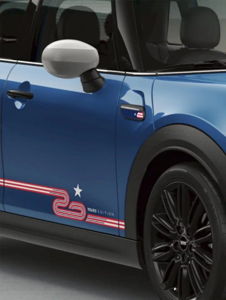 Closeup view of the passenger’s side door on an Island Blue MINI 20 Years Edition Hardtop 4 Door Cooper S, including 17” Tentacle Spoke black wheels with all-season tires. | MINI of Sterling in Sterling VA