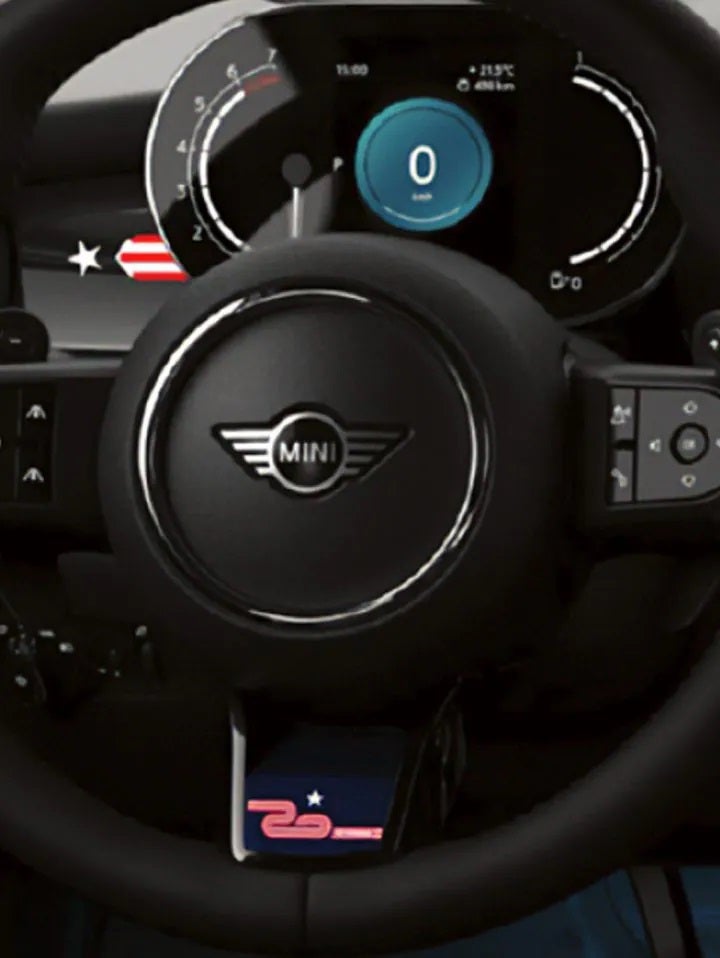 Closeup view of a nappa leather steering wheel with 20 Years Edition insert and paddle shifters. | MINI of Sterling in Sterling VA