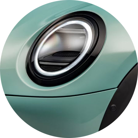 A close-up of the MINI Cooper S 2 Door’s circular headlights.