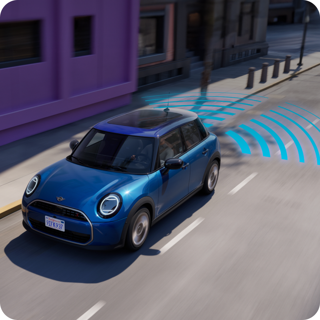 Bird’s-eye view of the MINI Cooper 4 Door surrounded by blue warning signs.