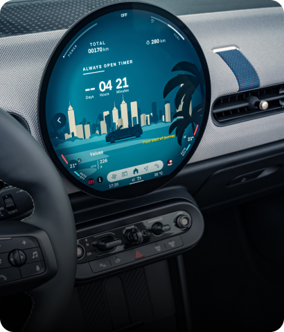 A close-up of the MINI Head-up Display with parts of the steering wheel and MINI OLED Display visible.
Everything you