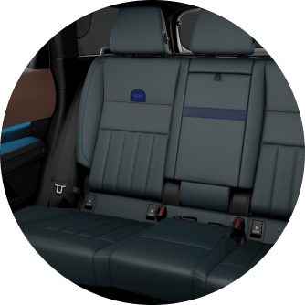 Angled-view of a MINI Cooper 4 Door parked in front of an industrial garage.