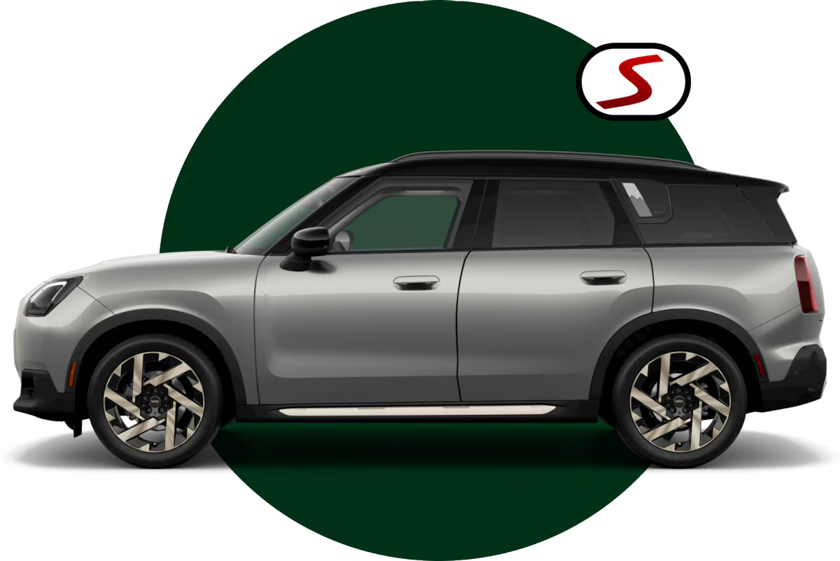 Side view of a 2025 MINI Countryman S ALL4 facing left and parked on a blank surface with its shadow underneath it, along with a dark-green circle positioned behind it over a light-blue backdrop.